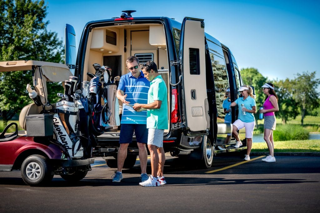 people loading golf clubs from Ultimate Coach